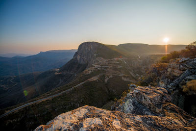 Scenic view of mountains against sky during sunset