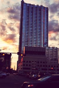 View of city street at sunset