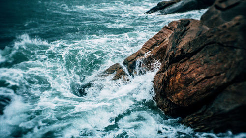 High angle view of rocks in sea