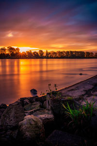 Scenic view of lake against sky during sunset