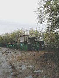 Abandoned building on field against sky