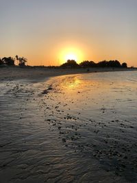 Scenic view of sea against clear sky during sunset