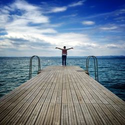 Scenic view of sea against cloudy sky
