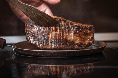 Close-up of person preparing food