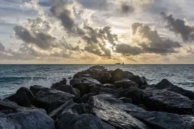 Scenic view of sea against cloudy sky