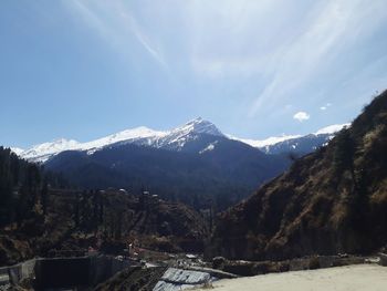 Scenic view of mountains against sky during winter