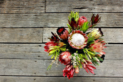 Directly above shot of flower vase on wooden table