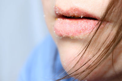 Close-up of woman against blurred background