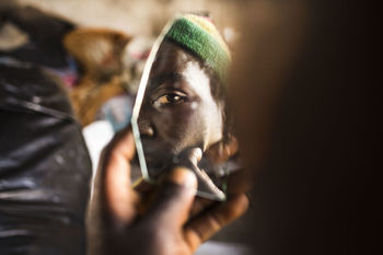 PORTRAIT OF MAN HOLDING CIGARETTE