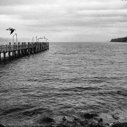 Scenic view of sea against cloudy sky