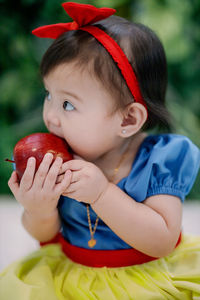 Close-up of cute girl eating food