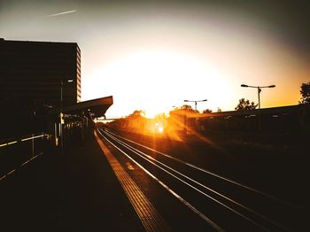 Railroad station platform at sunset