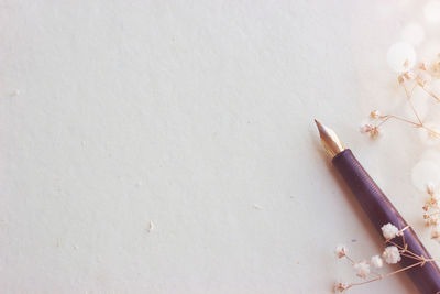 High angle view of pencils on white table