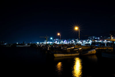 Illuminated ferris wheel at night