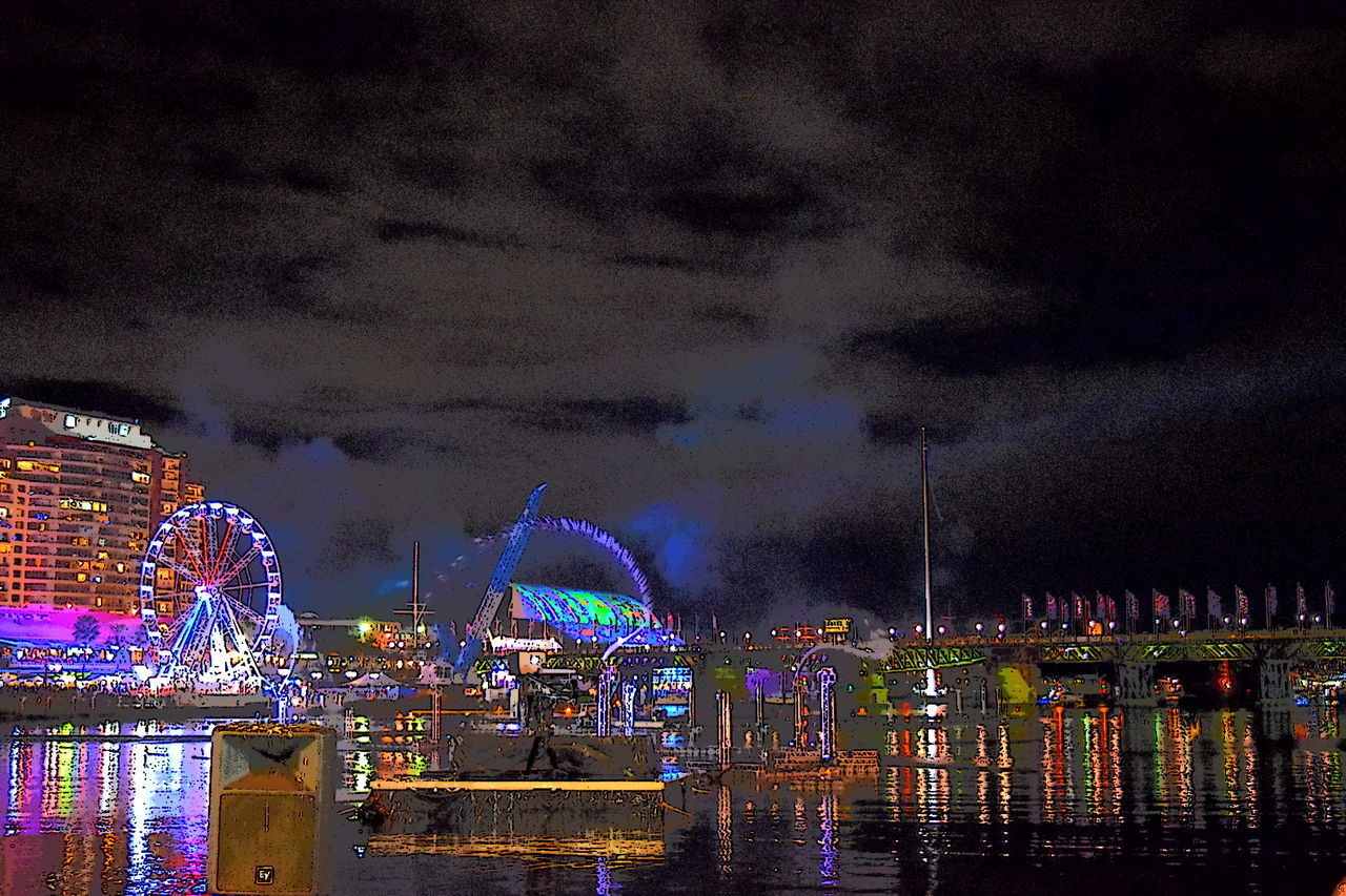 Illuminated amusement park at night