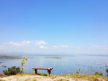 Scenic view of sea against blue sky