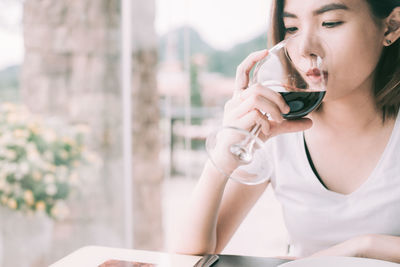 Portrait of woman drinking coffee