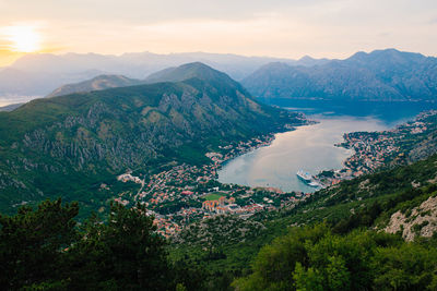 Scenic view of sea and mountains against sky