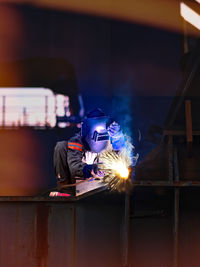 Welder working in factory