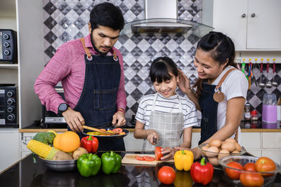 Family preparing food at home