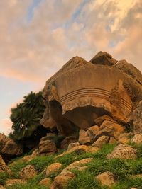 Low angle view of rock formation against sky