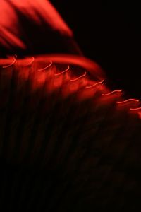 Close-up of red lights against black background