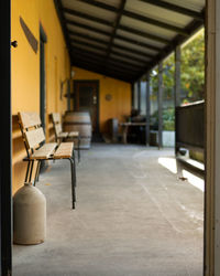 Empty chairs and tables in building