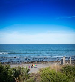 Scenic view of sea against blue sky