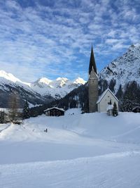 Panoramic view of buildings against sky during winter