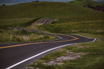 Aerial view of road passing through land