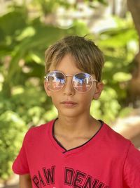 Portrait of young boy wearing sunglasses