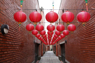 Red lanterns hanging by building
