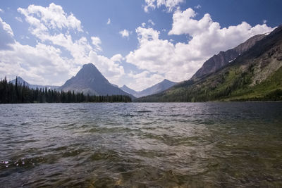 Scenic view of lake and mountains against sky