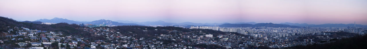 Panoramic view of illuminated city against sky