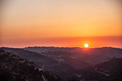 Scenic view of mountains against sky during sunset