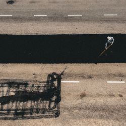 High angle view of man shadow on road