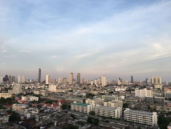 Aerial view of modern buildings in city against sky