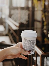 Close-up of woman holding coffee cup