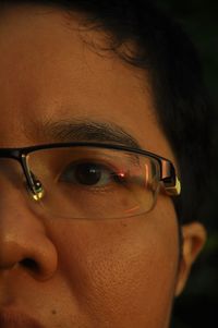 Close-up portrait of woman wearing eyeglasses