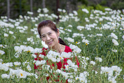 Portrait of a smiling young woman outdoors