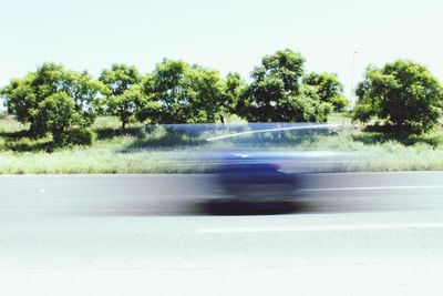 Blurred motion of road against clear sky