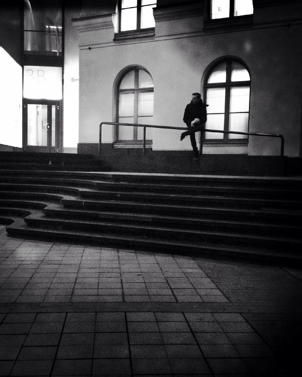 architecture, built structure, building exterior, walking, men, full length, building, cobblestone, lifestyles, steps, window, arch, city, railing, person, reflection, tiled floor, day