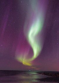 Scenic view of sea against sky at night