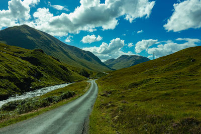 An aerial panorama of the road following the river etive near to glencoe, scotland on a summers day