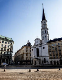 St michaels church in city against clear sky