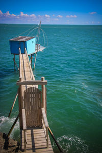 Pier on sea against sky