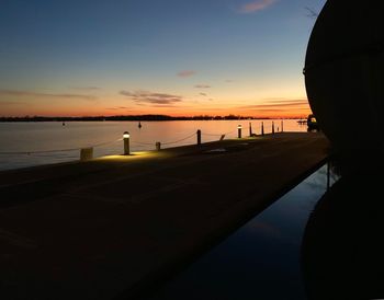 Scenic view of beach against sky during sunset