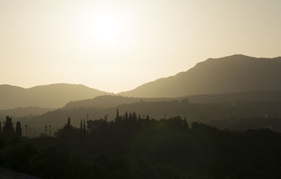 Scenic view of silhouette mountains against clear sky