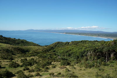 Scenic view of sea against clear blue sky