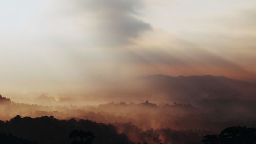 Scenic view of silhouette landscape against sky during sunset